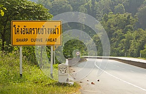 Road Signs warn Drivers for Ahead Dangerous Curve.