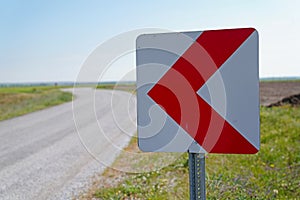Road signs warning drivers about ahead dangerous curve