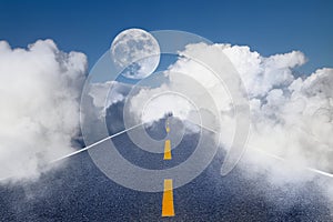 Road in the sky, white clouds and the moon.