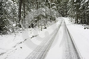 Road with snow at Abernethy in the Highlands of Scotland.