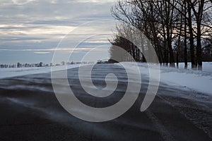 Road in a snow blizzard in the day