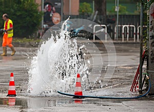 Road spurt water beside traffic cones