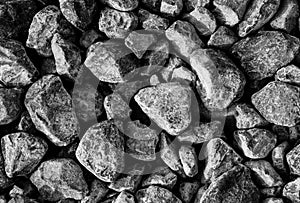 Road stones gravel texture, rocks for construction, gray background of crushed granite gravel, small rocks, closeup