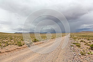 Road and storm clouds, Bolivia