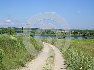 Road summer field greens water