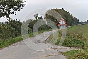 Road surface damage warning