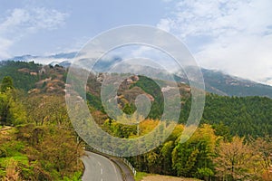 Road surrounded by beautiful mountain and nature during Spring