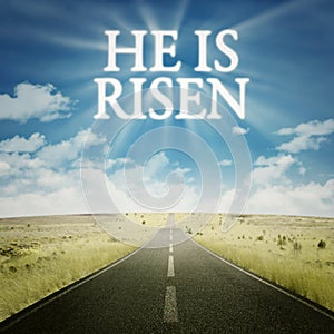 Road with text he is risen on the sky