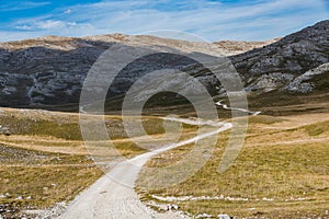 Road till horizon, rural stepe and curvy hills,Bosnia