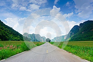 Road to beautiful nature, mountain, blue sky.