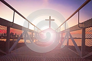 Road to heaven conceptï¼šsilhouette christian cross at bridge and orange sky with lighting