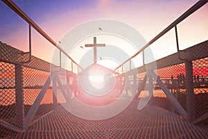 Road to heaven conceptï¼šsilhouette christian cross at bridge and orange sky with lighting