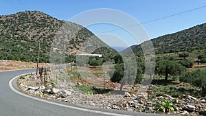 Road to mountain village Krasi on Crete /Greece. Driving along a road with view over Bay of Malia.