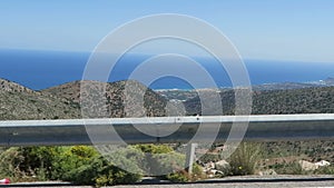 Road to mountain village Krasi on Crete /Greece. Driving along a road with view over Bay of Malia.