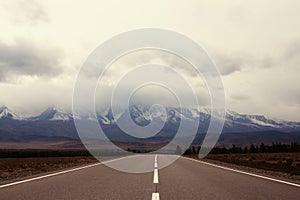 Road to the mountains. asphalt with markings for cars