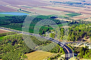 The road to Nazareth. Cars are driving along the highway.