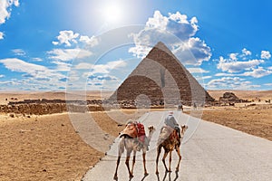 Road to the Pyramid of Menkaure and the bedouin with camels, Giza, Egypt