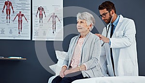 On the road to reclaiming her health. a doctor examining a senior patient with a stethoscope in a clinic.