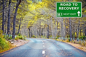 ROAD TO RECOVERY road sign against clear blue sky