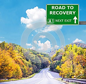 ROAD TO RECOVERY road sign against clear blue sky