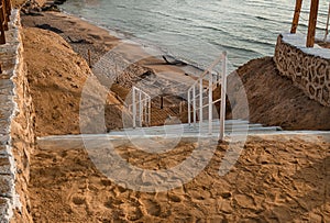 Road to the sea is made of sandstone and clay steps. Stairway to the beach, concept of rest