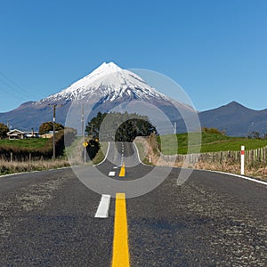 Road to a snow capped mount Taranaki, New Zealand