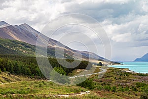 Road to the Southern Alps. The hilly shores of Lake Pukaki. New Zealand