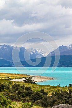 Road to the Southern Alps. The hilly shores of Lake Pukaki. New Zealand