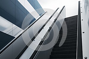 Road to success concept with bottom view on modern escalator outside leading to the street with sky background. 3D rendering