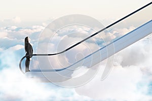 Road to success concept with businesswoman going up by escalator among clouds