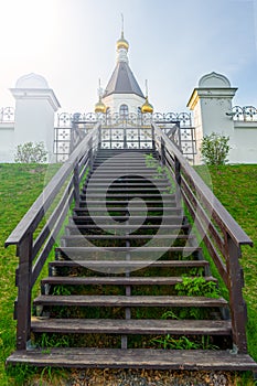 The road to the temple. stairs to the Orthodox Church. Russia, Krasnoyarsk. Domes against the sky