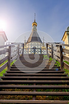 The road to the temple. stairs to the Orthodox Church. Russia, Krasnoyarsk. Domes against the sky