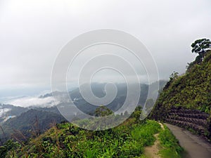 Road on the top of mountain with Mist rolling