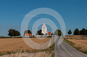 Road towards church of Kastrup near Vordingborg in Denmark