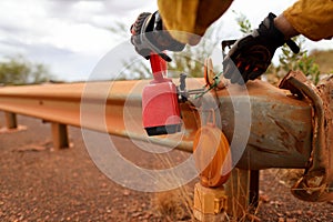 Road traffic authorize person wearing safety glove holding red warning flashing light