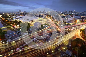 Road traffic at Bangkok city with skyline at night by technic long exposure shoot, Thailand