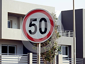 A road traffic sign in Egypt that gives an alert to drivers 50 fifty kilometer per hour is the maximum speed limit, over 50 KM