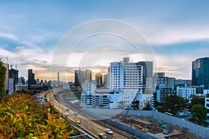 road traffic transportation and city in bangkok at twilight sunray and tree pot