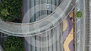 Road traffic tropical view, video of the Interstate 110 with palms growing in the divider, artistic cinematic motion