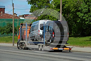 Road train carrying two minibuses photo