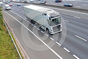 Road transport. Lorry in motion. photo
