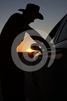 Road transport transportation - tired, drunk or lost driver rest close car by sunset or sunrise after long night travel. Or