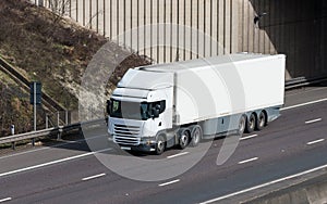 Road transport - white lorry on the motorway