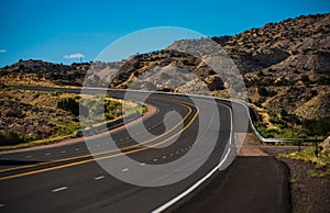 Road trip in Arizona desert. Beautiful countryside landscape. Western Utah countryside highway during hot summer day