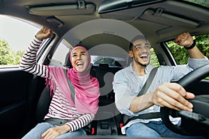 Road Trip. Excited Happy Muslim Spouses Having Fun While Riding Car Together