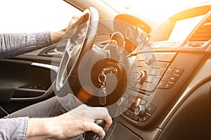 Road trip. Happy young man have fun travel inside car at sunset. Summer vacation concept with driver