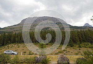 Road trip Mountain Landscape with Car in the foreground