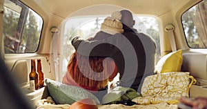 Road trip, nature and couple hug in car from back, relax on adventure together with love and freedom. Camping journey