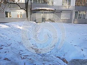 Road and trodden path in the snow