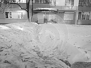 Road and trodden path in the snow